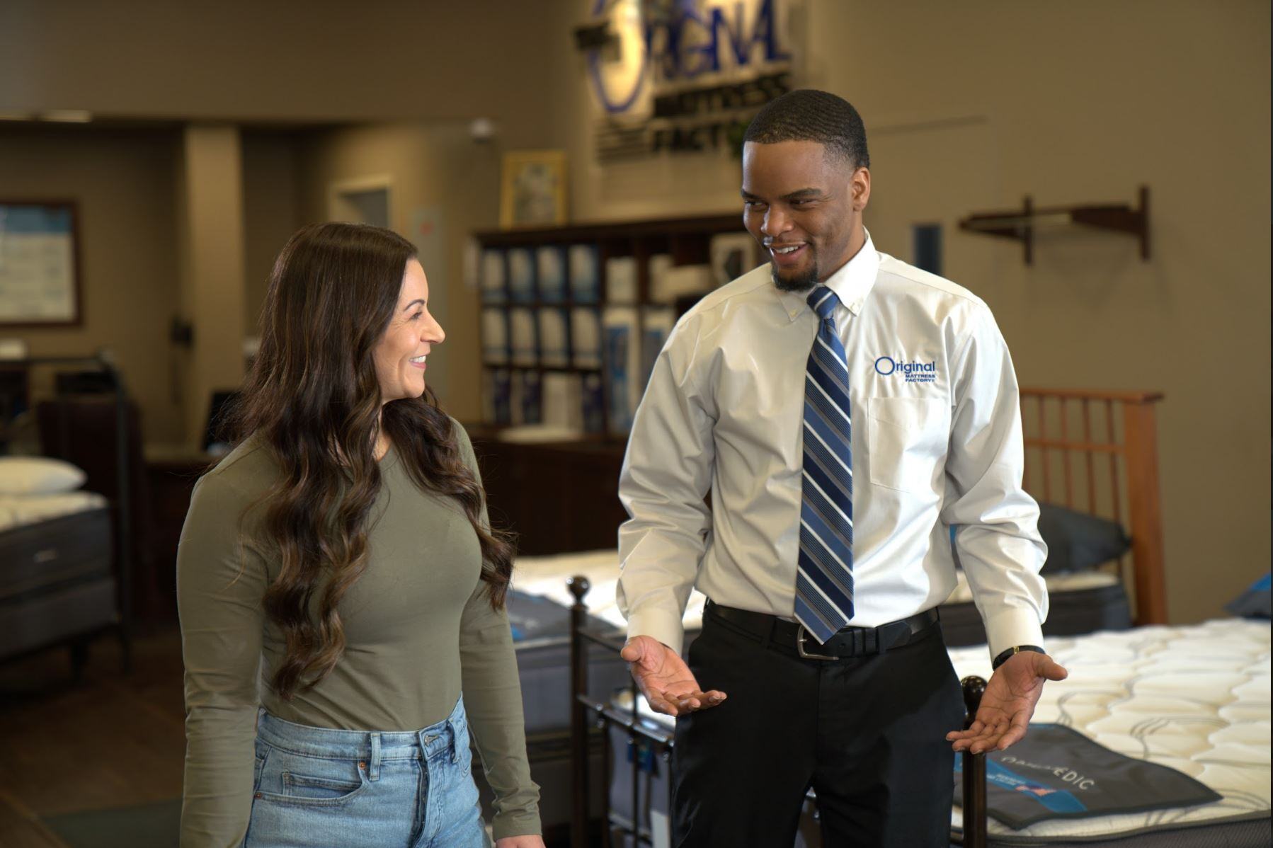 a woman shopping for a mattress and asking what's the best mattress